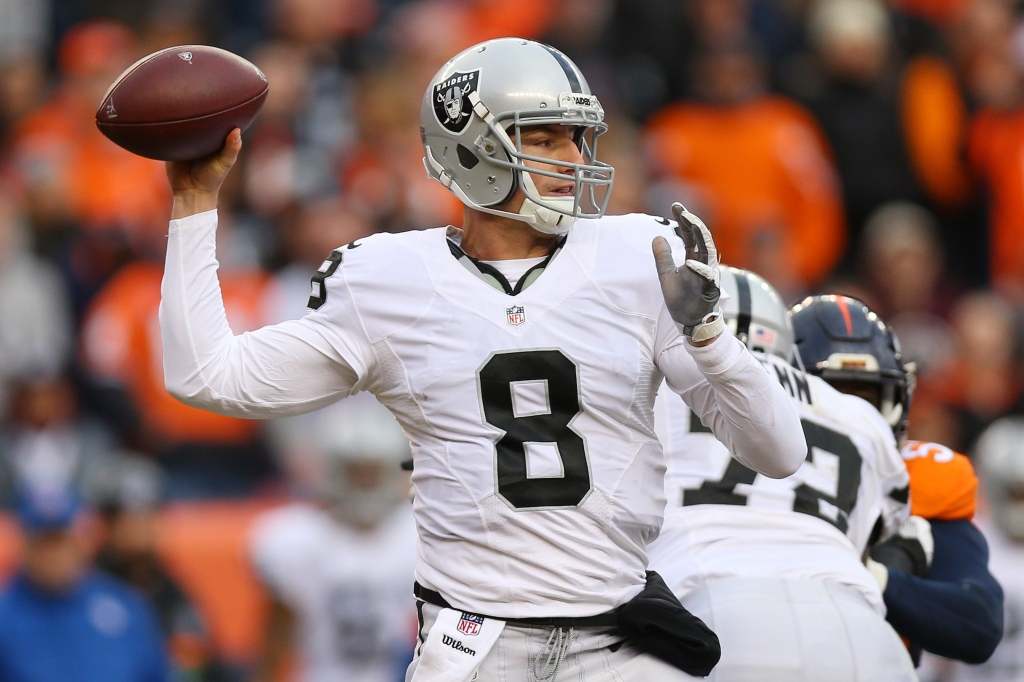 DENVER CO- JANUARY 1 Quarterback Connor Cook #8 of the Oakland Raiders throws in the second quarter of the game against the Denver Broncos at Sports Authority Field at Mile High