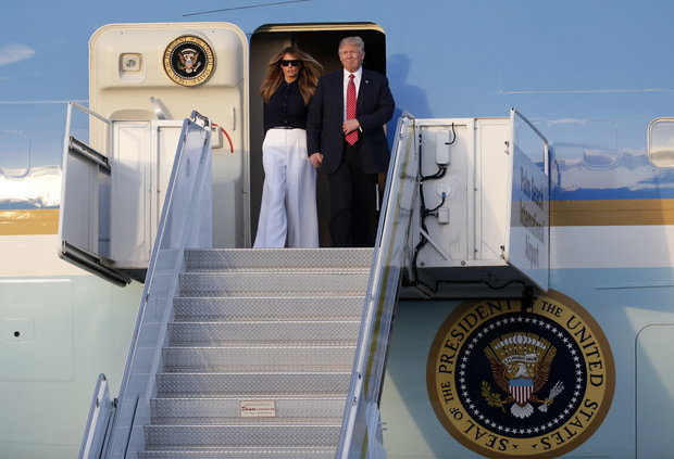 President Donald Trump and first lady Melania Trump step off of Air Force One as they arrive in West Palm Beach Fla. Friday Feb. 10 2017