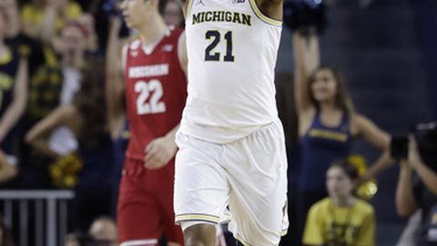 Michigan guard Zak Irvin reacts after a 3-point basket during the first half of the team's NCAA college basketball game against Wisconsin Thursday Feb. 16 2017 in Ann Arbor Mich