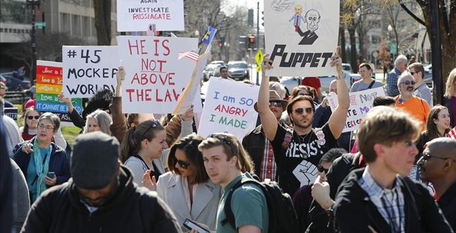 Thousands of demonstrators across US say 'Not My President&#39