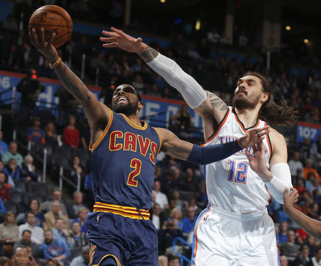 Cleveland's Kyrie Irving left goes to the basket past Oklahoma City's Steven Adams during Thursday night's NBA game at Chesapeake Energy Arena. Oklahoma City beat the Cavs 118-109