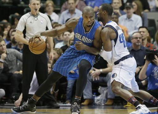 Orlando Magic forward Serge Ibaka dribbles against Dallas Mavericks forward Harrison Barnes during the second half of an NBA basketball in Dallas Saturday Feb. 11 2017