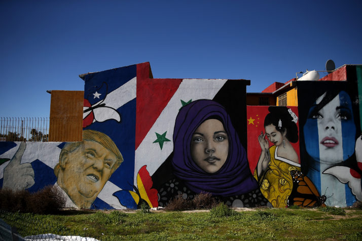 A mural of U.S. President Donald Trump is displayed on the side of a home