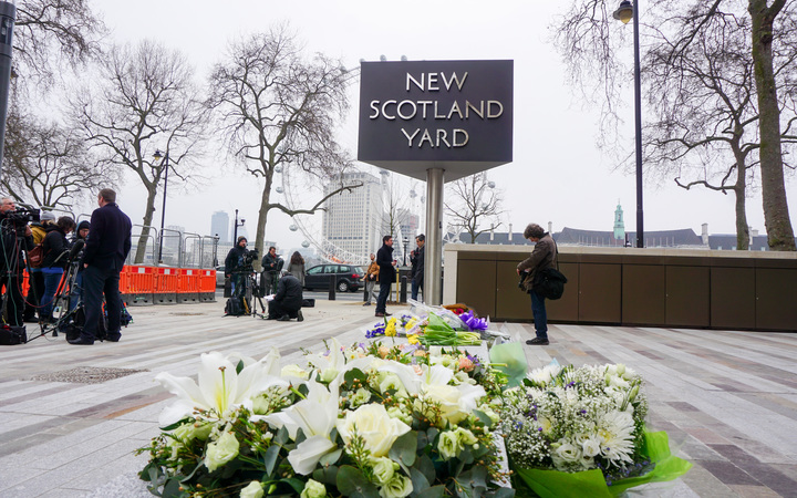 A tribute to the victims of the attack left at Scotland Yard