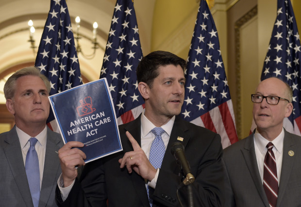 House Speaker Paul Ryan of Wis. center standing with Energy and Commerce Committee Chairman Greg Walden R-Ore. right and House Majority Whip Kevin McCarthy R-Calif. left speaks during a news conference on the American Health Care Act on Capitol Hi