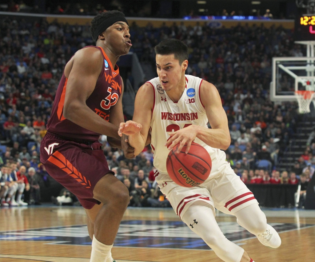 Associated Press
Wisconsin guard Bronson Koenig drives to the basket against Virginia Tech forward Zach Le Day during Thursday’s game