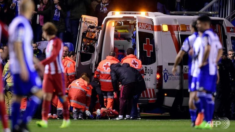 Atletico Madrid's forward Fernando Torres is evacuated in an ambulance due to an injury.
   
 

  Enlarge  Caption