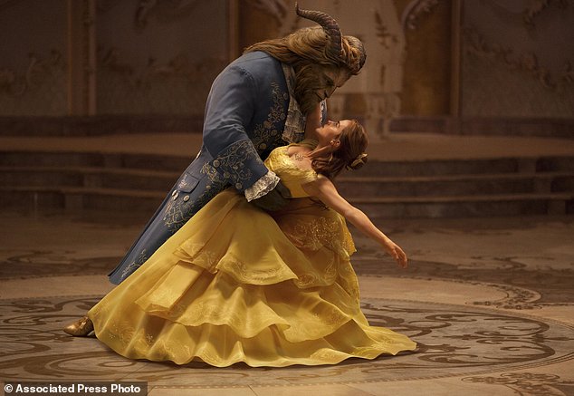 This image released by Disney shows Dan Stevens as The Beast left and Emma Watson as Belle in a live-action adaptation of the animated classic'Beauty and the Beast