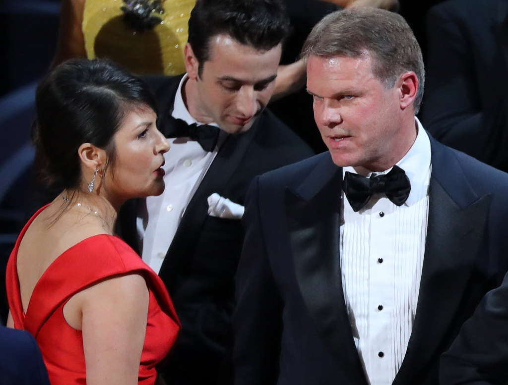 89th Academy Awards- Oscars Awards Show- Hollywood California U.S.- 26/02/17- Brian Cullinan and Martha Ruiz of Pricewaterhouse Coopers confer on stage after the Best