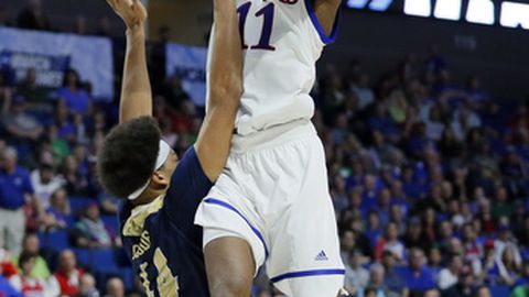 Kansas'Josh Jackson goes up for a shot as UC Davis&#039 Garrison Goode defends in the second half of a first-round game in the men's NCAA college basketball tournament in Tulsa Okla. Friday