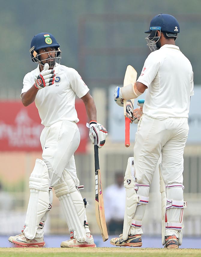 Cheteshwar Pujara and Wriddhiman Saha. Pic  PTI