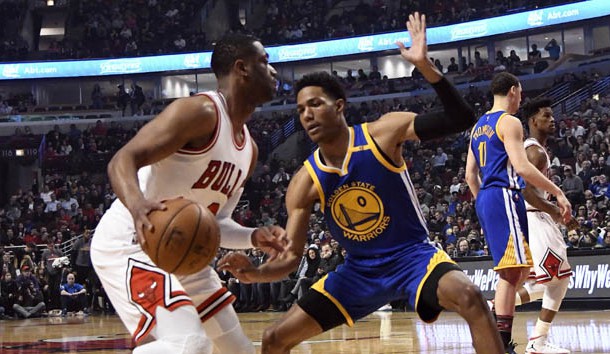 Mar 2 2017 Chicago IL USA Chicago Bulls guard Dwyane Wade is defended by Golden State Warriors guard Patrick Mc Caw during the first quarter at the United Center