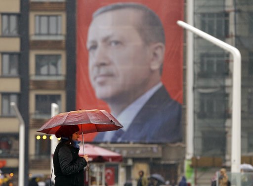 Recep Tayyip Erdogan is seen on a building in central Istanbul's Taksim Square Tuesday