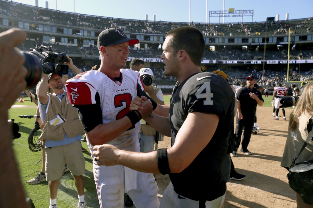 Sep 18 2016 Oakland CA USA Atlanta Falcons quarterback Matt Ryan meets with Oakland Raiders quarterback Derek Carr after the game at Oakland Alameda County Coliseum. The Falcons defeated the Raiders 35-28. Mandatory Credit Cary Edmondson-USA