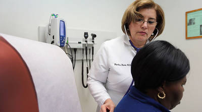 The CBO estimates that 24 million people will lose health insurance under the Republican plan to replace Obamacare. Above Dr. Martha Perez examines Dorothy Jolly at Community Health of South Florida