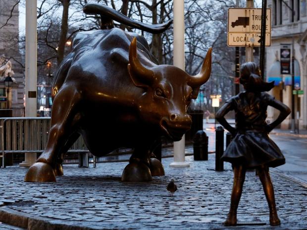 Charging Bull has new company in a bronze statue of a young girl — a symbol for women's place on Wall Street