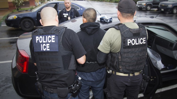 Immigration and Customs Enforcement people are arrested during an ICE enforcement operation in Los Angeles