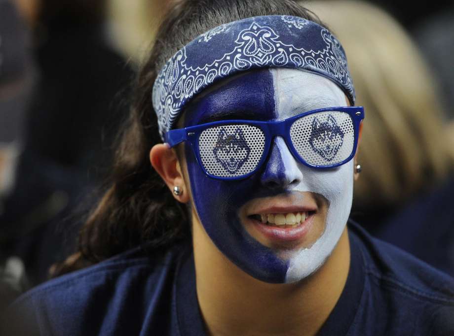 A UConn fan takes in the action during an NCAA tournament game in Bridgeport