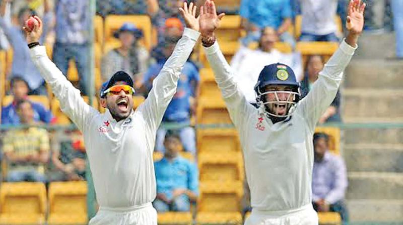 Karun Nair and Cheteshwar Pujara appeal for a wicket