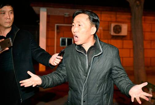 North Korean Ri Jong Chol speaks in front of reporters at the North Korean Embassy in Beijing early Saturday