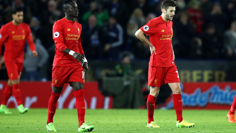 Liverpool players look dejected after their defeat at Leicester