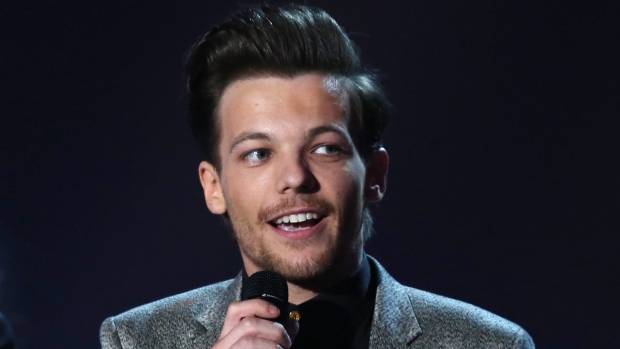 Singer Louis Tomlinson from the band One Direction was arrested Friday at LAX following an encounter with paparazzi