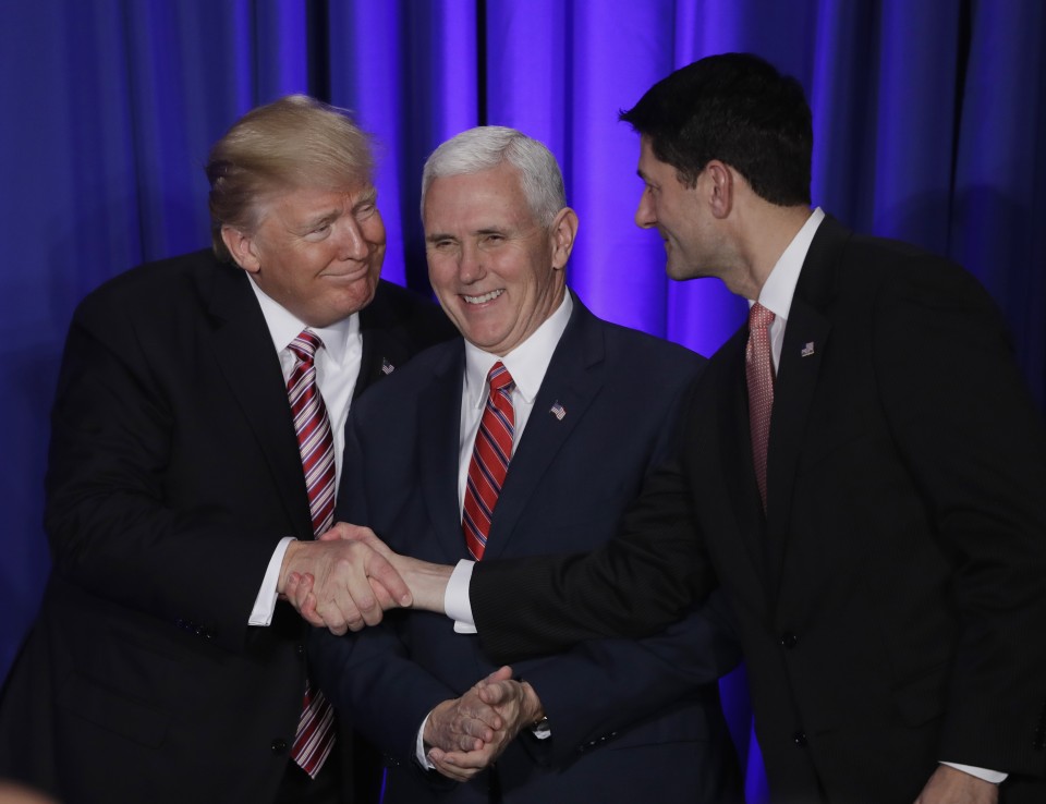 President Donald Trump accompanied by Vice President Mike Pence shakes hands with House Speaker Paul Ryan of Wis. Thursday Jan. 26 2017 prior to speaking at the Republican congressional retreat in Philadelphia