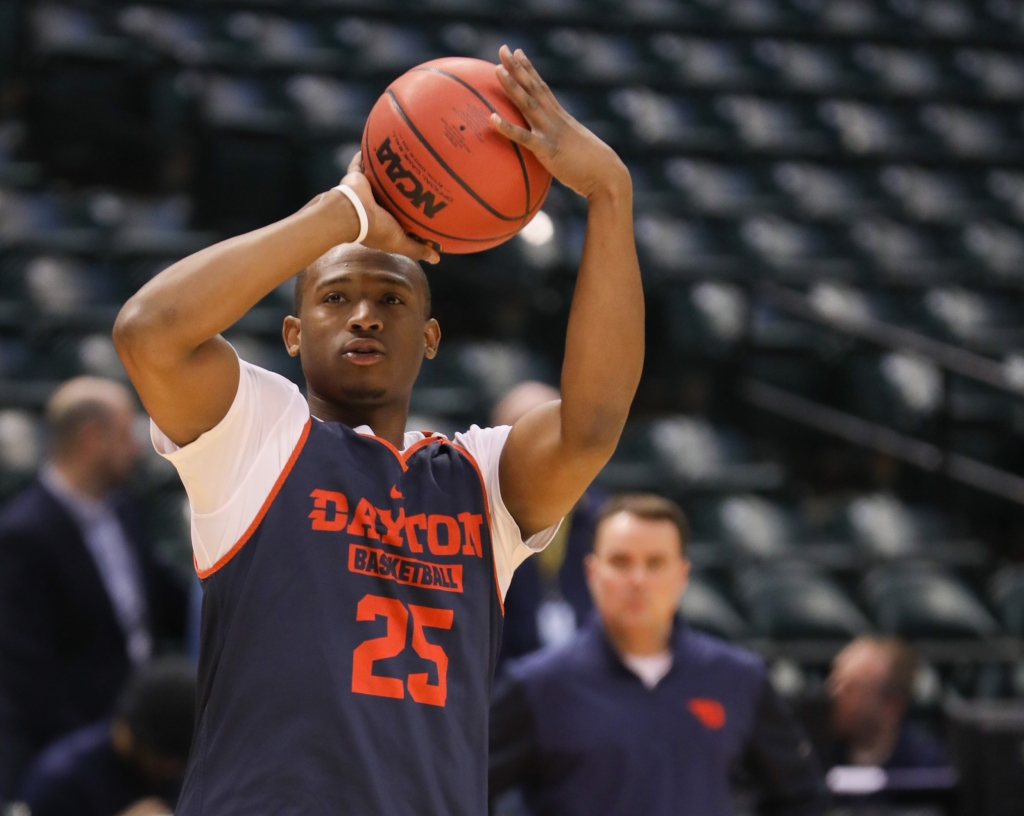 Dayton’s Kendall Pollard practices shooting threes at the open practice in Bankers Life Fieldhouse before facing Wichita State University Shockers on Friday