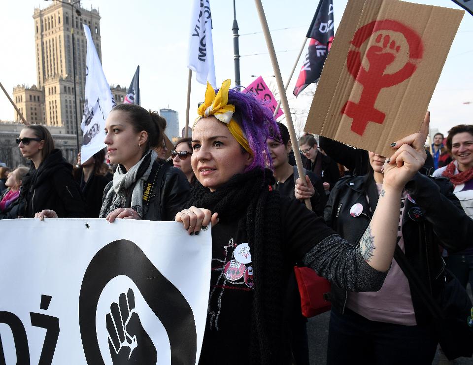 People take part in a protest to mark the International Women's Day