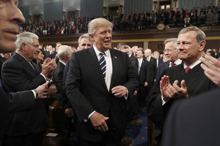 President Trump arrives to deliver his first address to a joint session of Congress on Tuesday evening