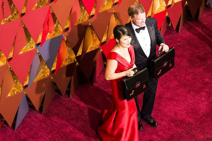 PricewaterhouseCoopers accountants Martha L. Ruiz left and Brian Cullinan right at the Oscars red carpet.
By Robyn Beck  AFP  Getty Images