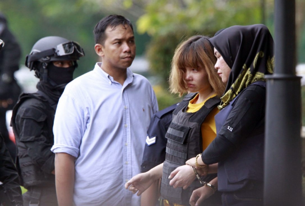 Doan Thi Huong second from right wearing a bulletproof vest as she left the courthouse in Kuala Lumpur Malaysia on Wednesday