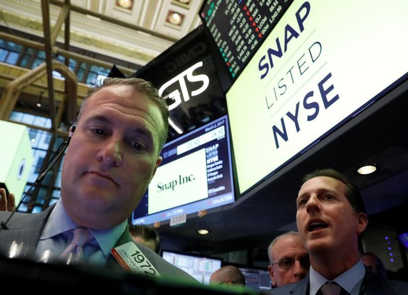 Specialist Trader Glen Carell gives a price for Snap Inc. during the company's IPO on the floor of the NYSE