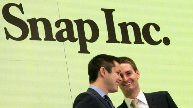 Snapchat co-founders Bobby Murphy left and CEO Evan Spiegel ring the opening bell at the New York Stock Exchange