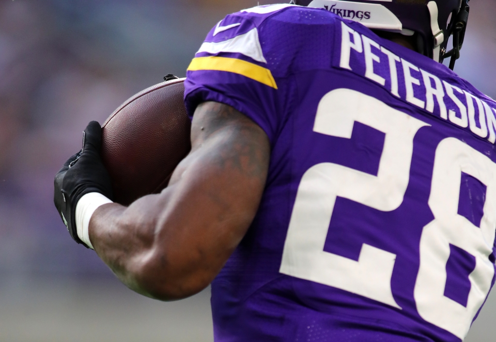 MINNEAPOLIS MN- DECEMBER 18 Adrian Peterson #28 of the Minnesota Vikings catches the ball in the first quarter of the game against the Indianapolis Colts