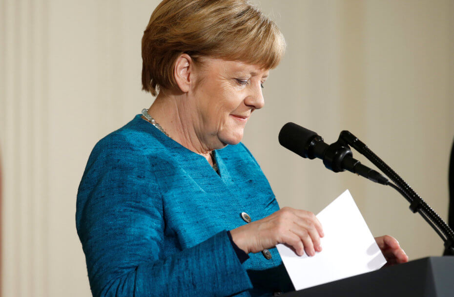 German Chancellor Angela Merkel sorts her notes during a joint news conference with U.S. President Donald Trump in the East Room of the White House in Washington U.S