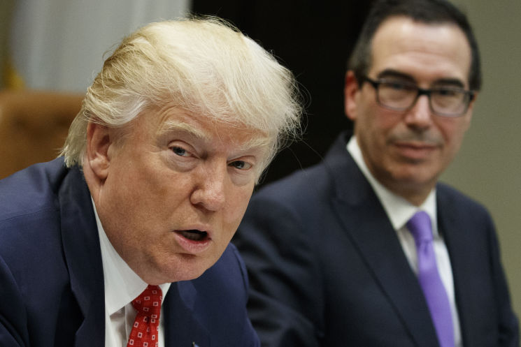 President Donald Trump and Treasury Secretary Steven Mnuchin attend a meeting on the federal budget at the White House last month. Trump’s budget embraces simplistic math and the wrong priorities and it will be up to Congress to set a more responsi