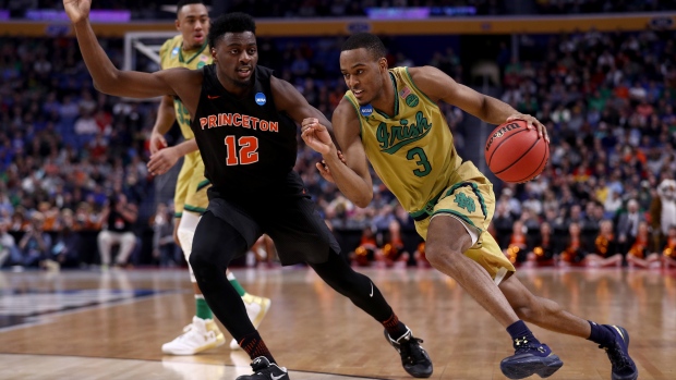 V.J. Beachem right of the Notre Dame Fighting Irish held on to beat Myles Stephens of the Princeton Tigers during the first round of the 2017 NCAA tournament on Thursday