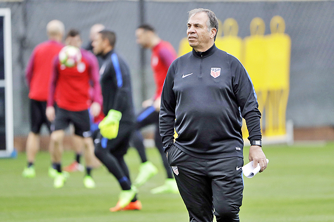 United States head coach Bruce Arena watches his team during a training session.- AP