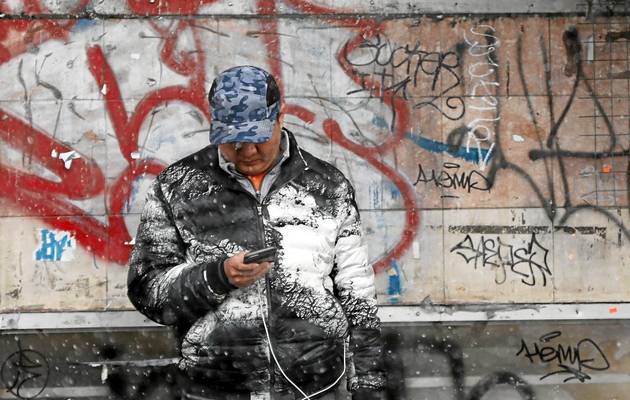 WHITEOUT A man waits for a bus in the falling snow of Storm Stella in the New York borough of Queens.              
    Image by REUTERS