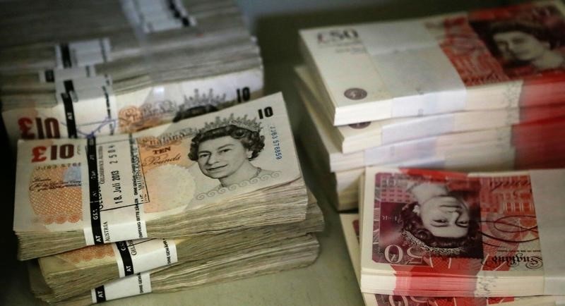 Wads of British Pound Sterling banknotes are stacked in piles at the GSA Austria company's headquarters in Vienna Ju