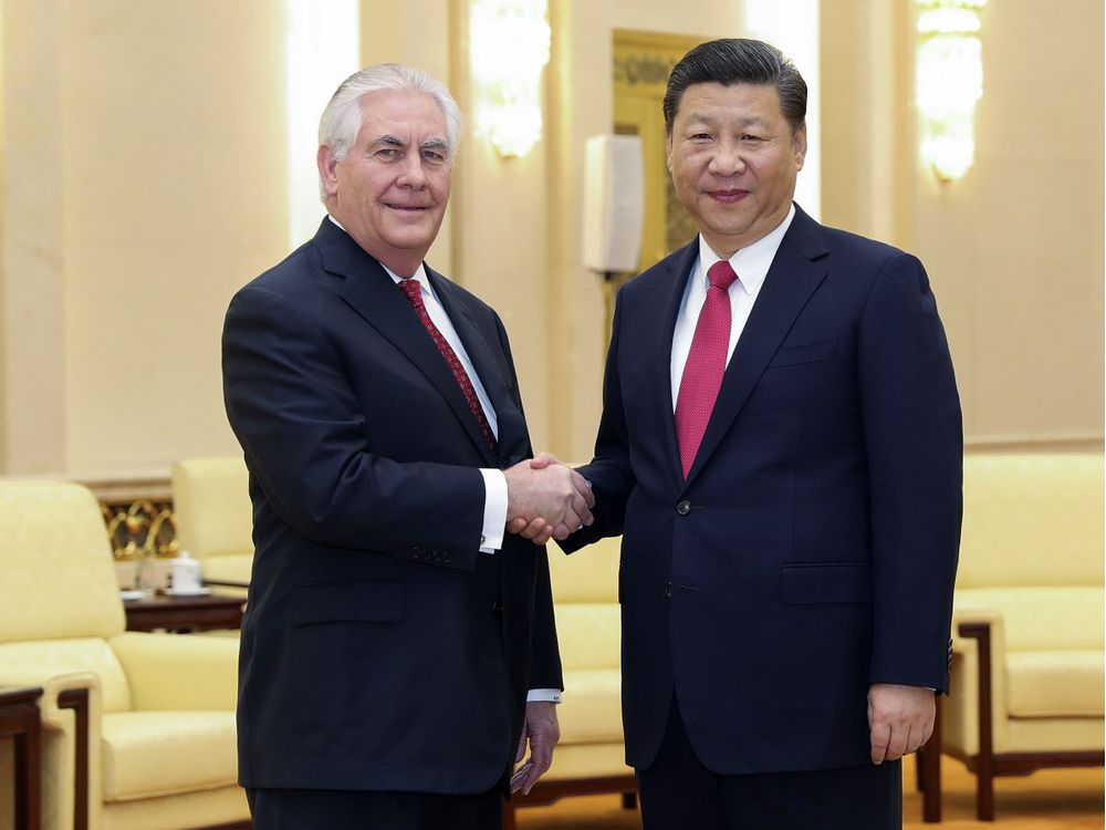 U.S. State of Secretary Rex Tillerson left shakes hands with China's President Xi Jinping at the Great Hall of the People in Beijing China Sunday