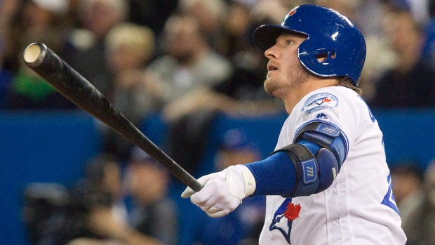 The Blue Jays&#39 Josh Donaldson watching his fourth-inning grand slam in their 2016 home opener against Boston is not in Toronto's lineup for Tuesday night's home opener against Milwaukee because of a sore right calf