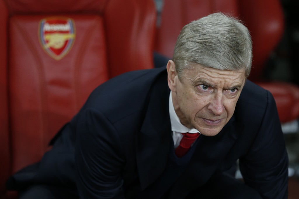 Arsenal's French manager Arsene Wenger looks on before the UEFA Champions League last 16 second leg football match between Arsenal and Bayern Munich at The Emirates Stadium in London