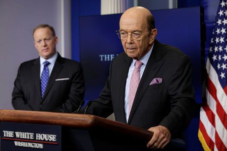 Commerce Secretary Wilbur Ross speaks next to Press Secretary Sean Spicer at the White House in Washington