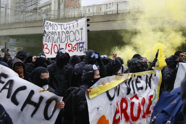 Protesters against far-right National Front leader and presidential candidate Marine Le Pen hold a banner reading “fascist” during a protest march from suburban Aubervilliers to Paris Sunday