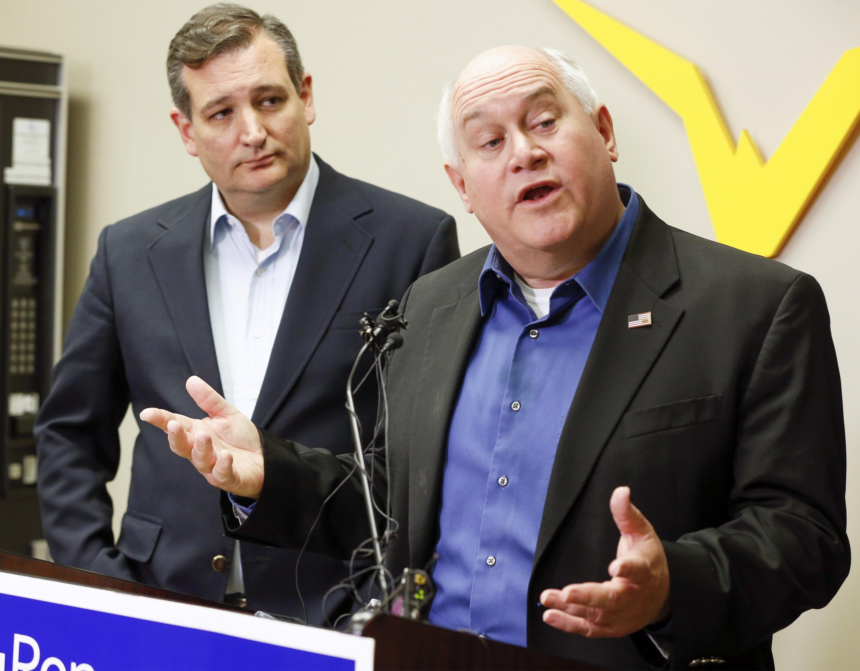 Kansas 4th District congressional candidate Ron Estes right and Sen. Ted Cruz who came to Wichita to campaign for Estes the day before a special election speak to the media before their rally at Yingling Aviation on Monday