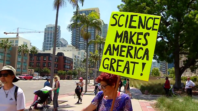 NBC 7A marcher holds up at sign at San Diego's March for Science Saturday