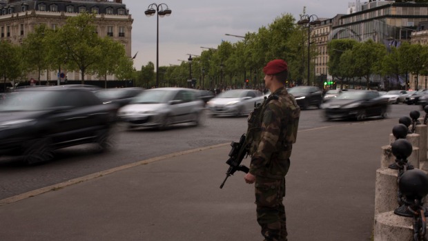 A French soldier stands guard near the Champs Elysees in Paris at the weekend. The presidential election is being