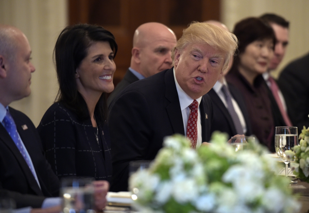 President Donald Trump sitting next to Nikki Haley U.S. ambassador to the United Nations speaks during a lunch with ambassadors of countries on the U.N. Security Council and their spouses on Monday at the White House